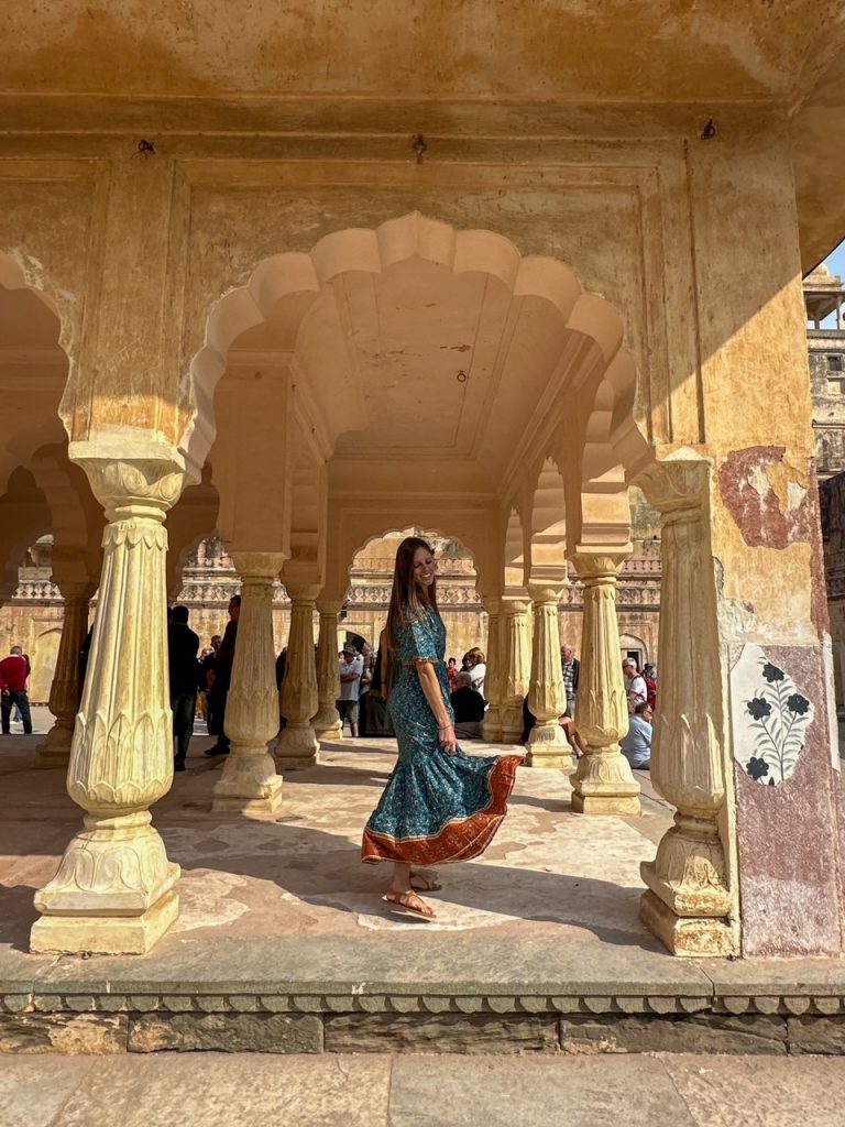 Sara twirling around in her dress at Amber Fort in Jaipur, India
