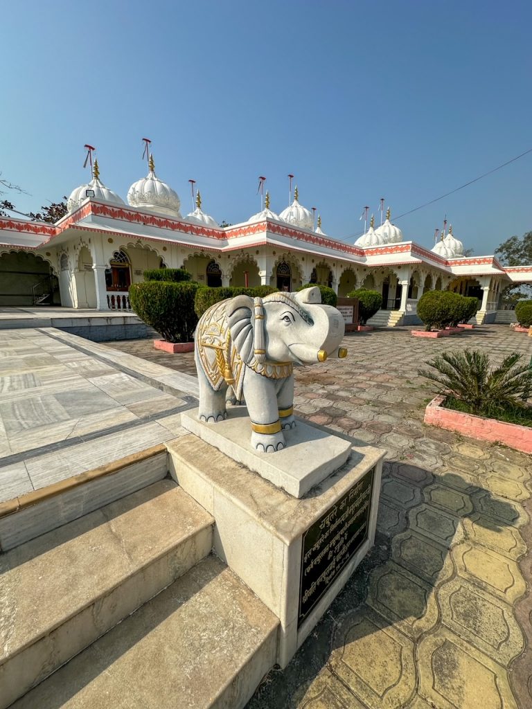 an elephant statue and some of the temples at Gomatgiri