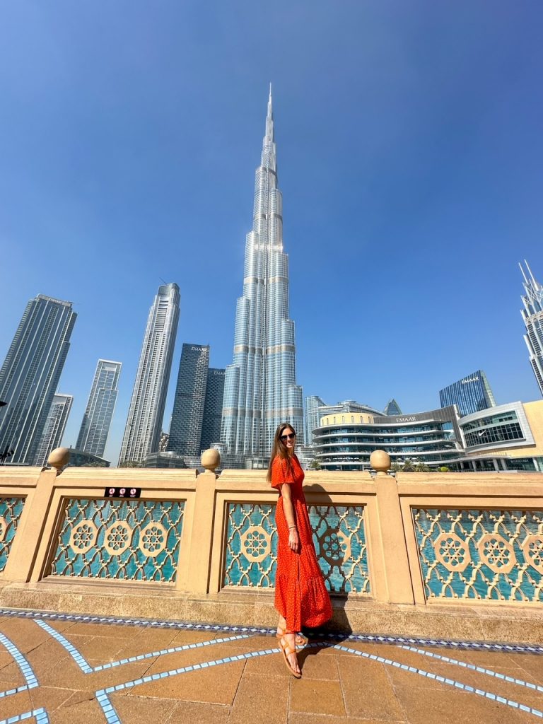 Sara in front of the Burj Khalifa, one of the top things to do in Dubai