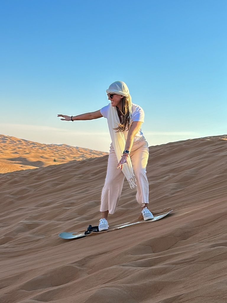 Sara trying sandboarding in Dubai