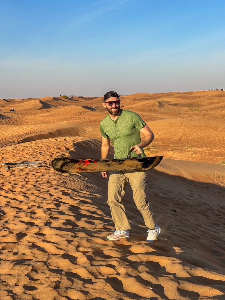 Tim with his sandboard in the Dubai desert