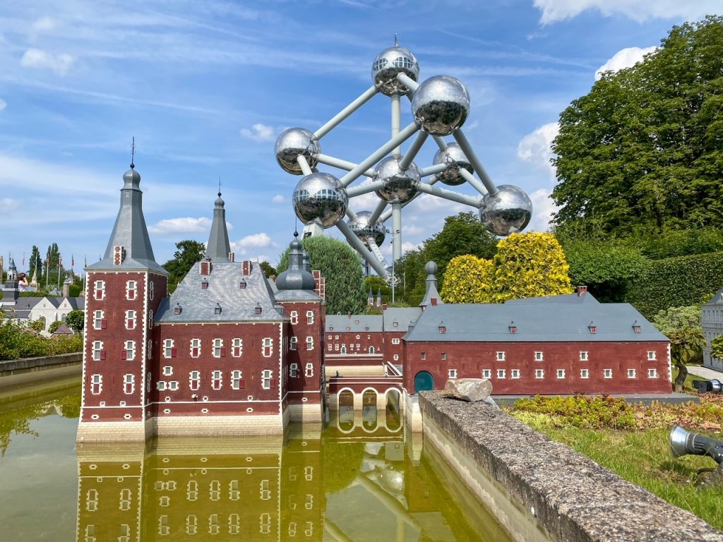 a model at Mini-Europe with the Atomium in the background