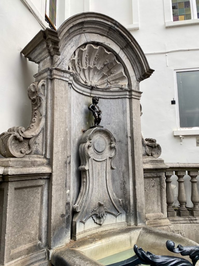 the infamous Manneken Pis, a must-see attraction in Brussels, Belgium