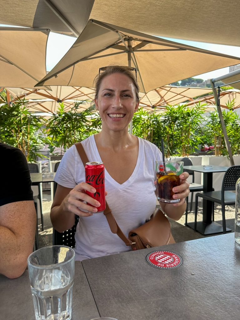 Kristen with her Coca Cola at La Brasserie de Monaco during a day trip to Monaco from Nice