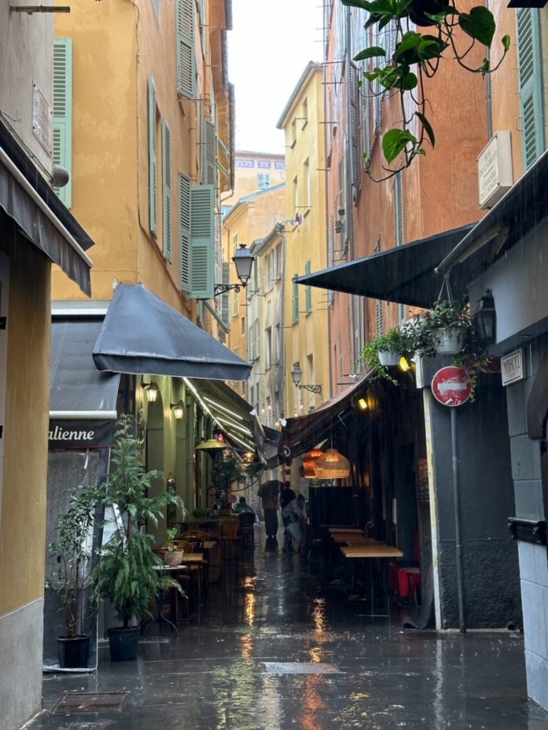 a charming street in Old Town Nice on a rainy day