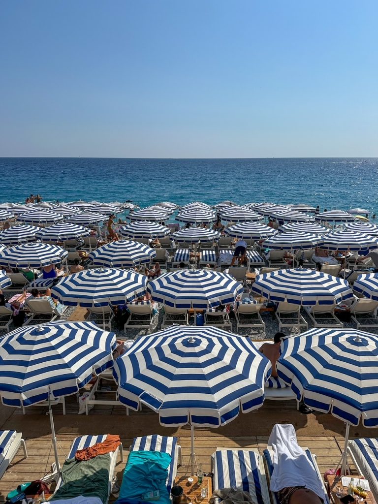 iconic blue and white striped umbrellas in Nice, France