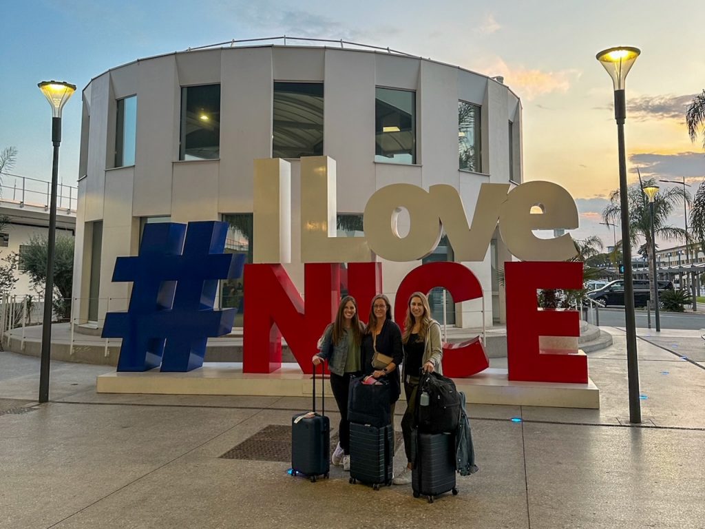 the girls in front of the #ILoveNice sign at the Nice Airport