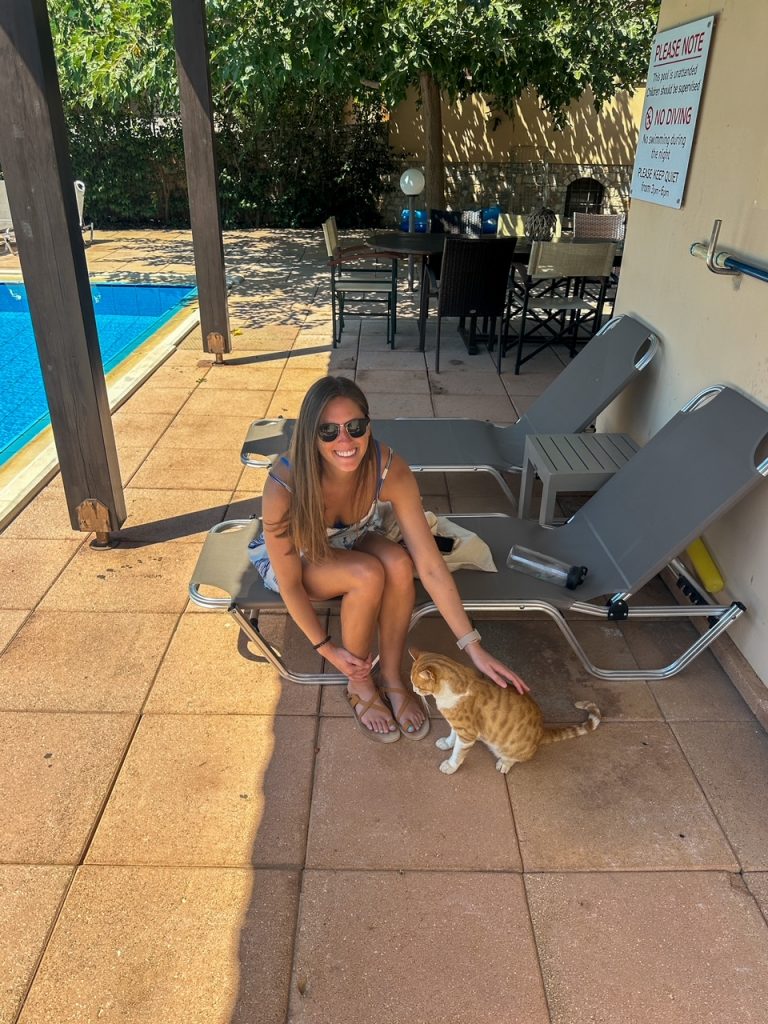 Sara with the cute cat outside Aphrodite Luxury Villa