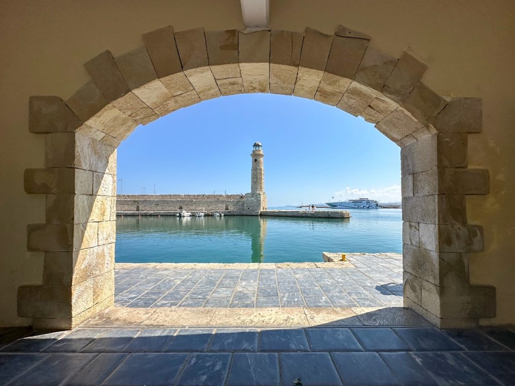a cool arch view of the Egyptian lighthouse in Rethymnon