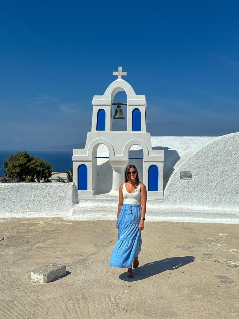 Sara in front of one of the churches in Oia