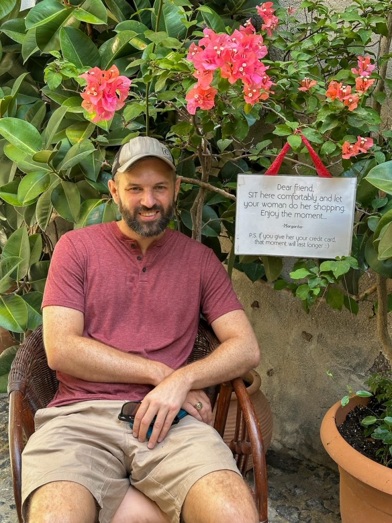 Tim waiting for the girls to shop in Fira
