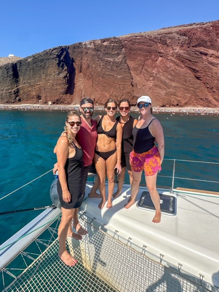 the group in front of Red Beach on the Santorini catamaran cruise