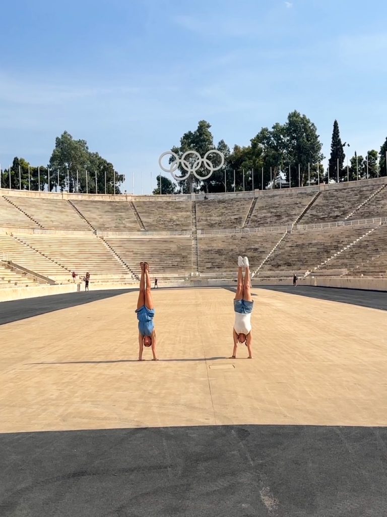 Sara & Kristen doing handstands at the Panathenaic Stadium
