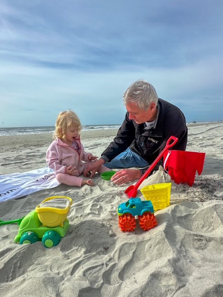 Lily and pop pop on the beach on Hilton Head Island