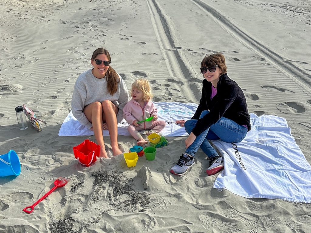 Sara & Kristina with Lily on the beach