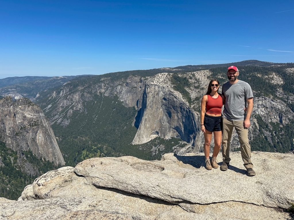 Sara and Tim in front of El Capitan at Taft Point on the third day of their Yosemite itinerary