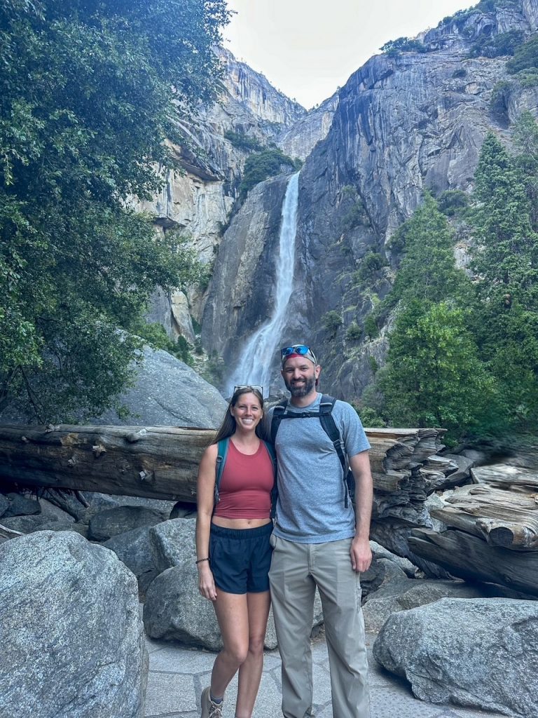 Sara and Tim in front of Lower Yosemite Falls in Yosemite National Park