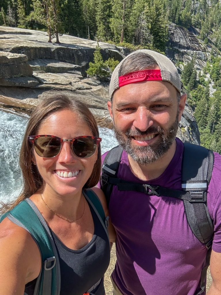 Sara and Tim taking a selfie at the top of Nevada Fall during their day of trekking the most epic hike in Yosemite