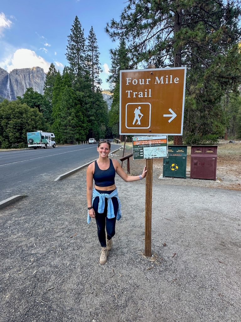 Sara at the Four Mile Trail sign after completing the most epic hike in Yosemite: the Mist - Panorama - Four Mile Trail combination hike