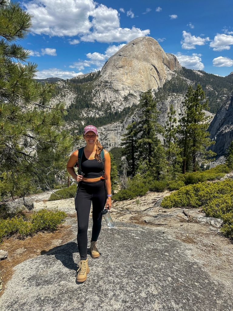 Sara in front of the back side of Half Dome along the Panorama Trail in Yosemite