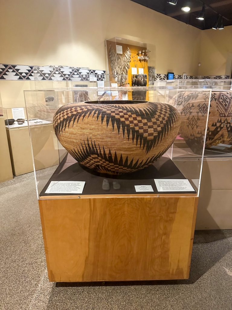 a famous, large basket made by Lucy Telles in 1933 that took four years to complete on display at the Yosemite Museum