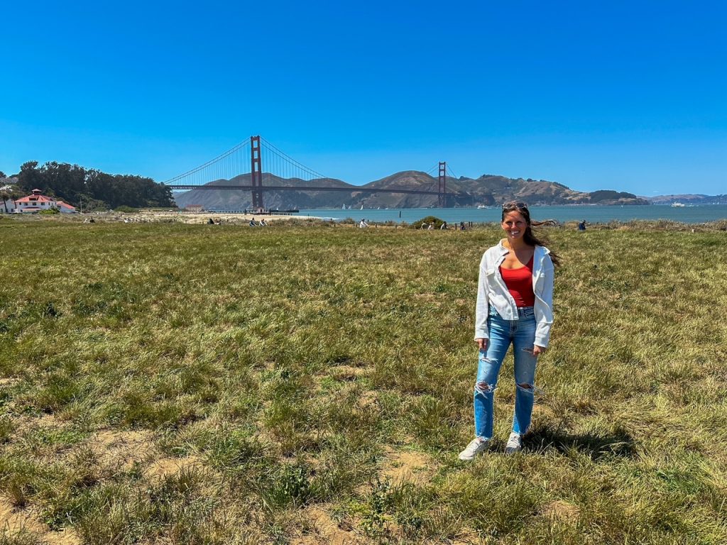 Sara in front of the Golden Gate Bridge at Crissy Field in San Francisco