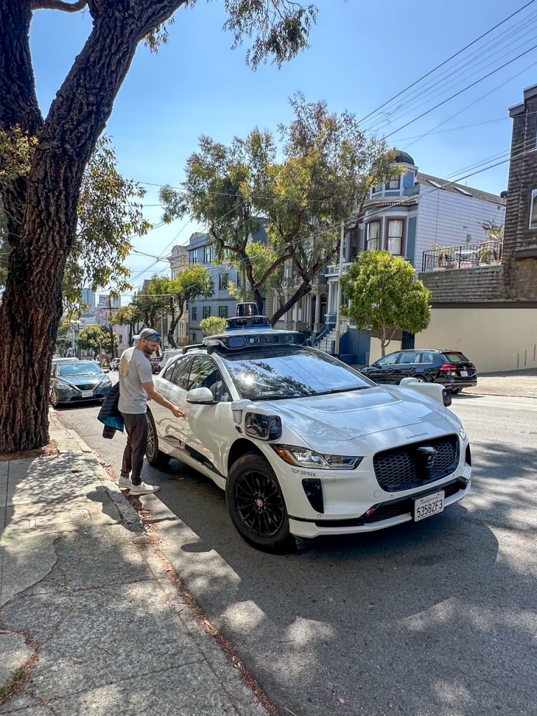 Tim getting into our Waymo near Alamo Square Park, a fun addition to our 3-day San Francisco itinerary