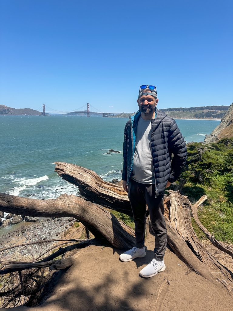 Tim in front of the Golden Gate Bridge on the Lands End Trail in San Francisco