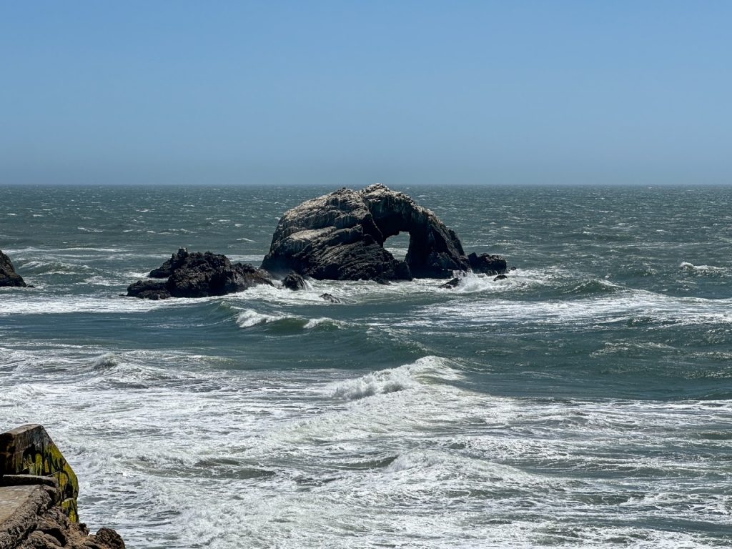 a massive rock in the Pacific ocean as seen from the Point Lobos Lookout in San Francisco