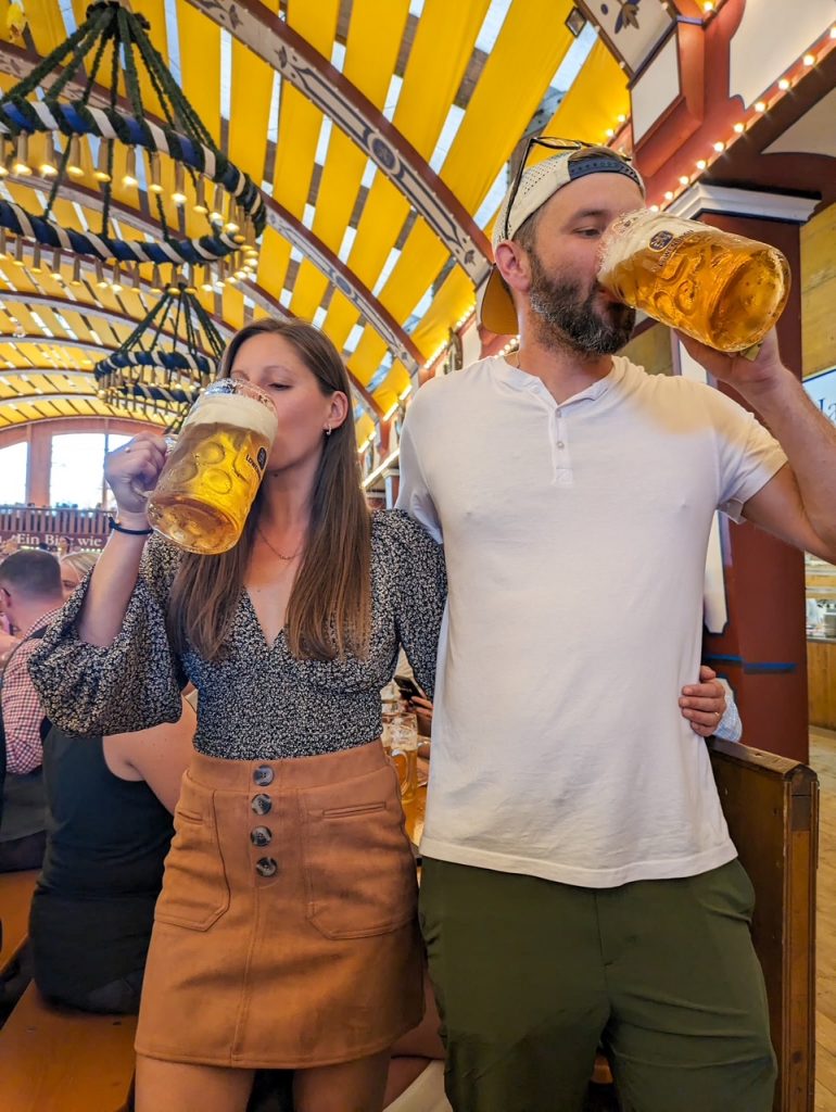 Couple drinking beer at an Oktoberfest in Munich beer tent