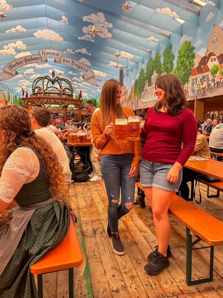 Girls cheersing their beer steins at Oktoberfest in Munich