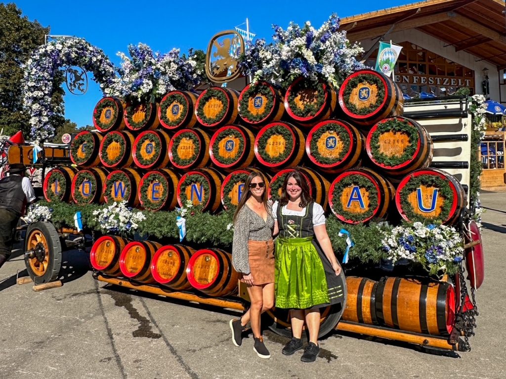 Sara and Abby in front of a horse-drawn beer keg wagon at Oktoberfest in Munich