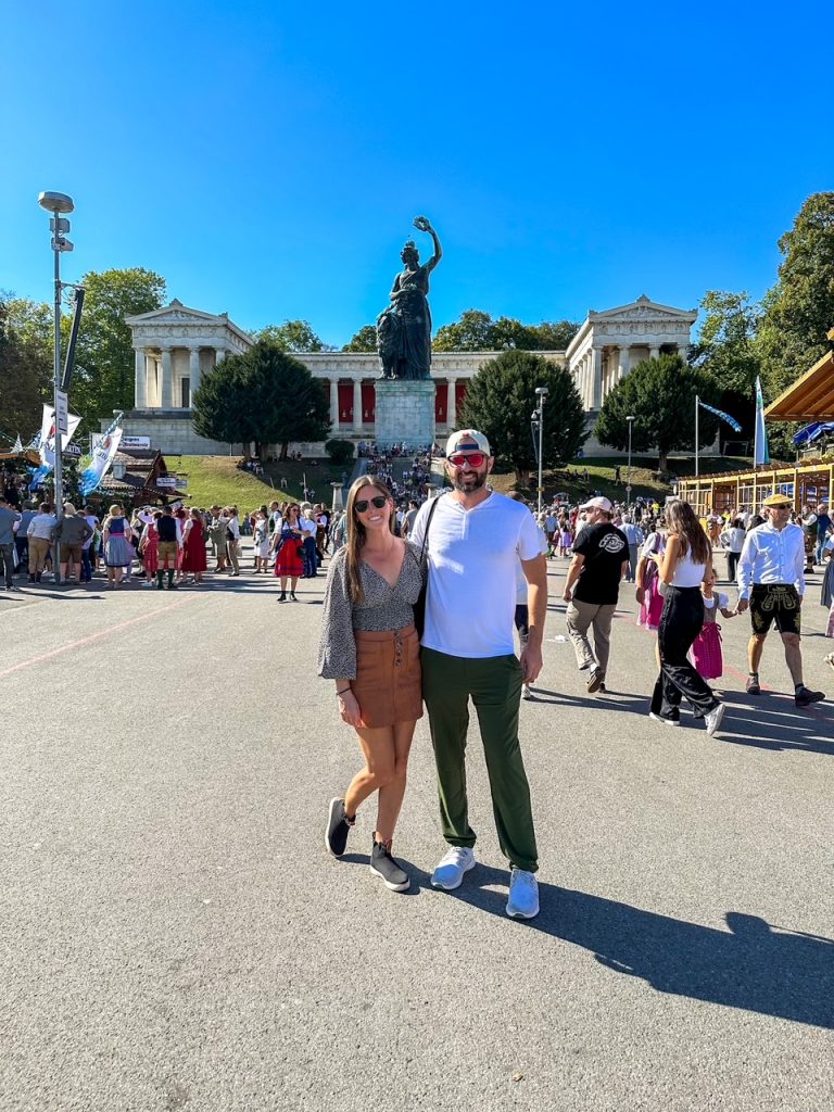 Sara and Tim in front of Lady Bavaria at Oktoberfest in Munich