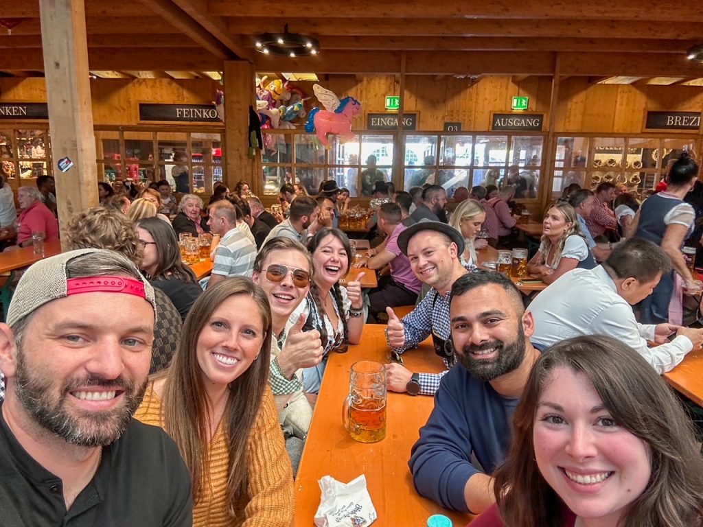 Tourists making friends at Hacker-Pschorr Festzelt at Oktoberfest in Munich