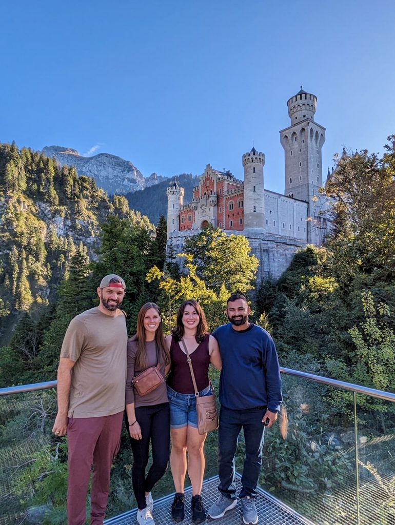 Group of friends in front of Neuschwanstein Castle in Bavaria