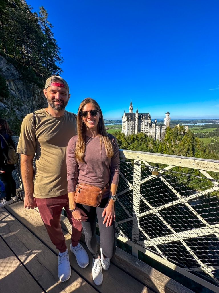 Sara and Tim overlooking Neuschwanstein Castle from Queen Mary’s Bridge