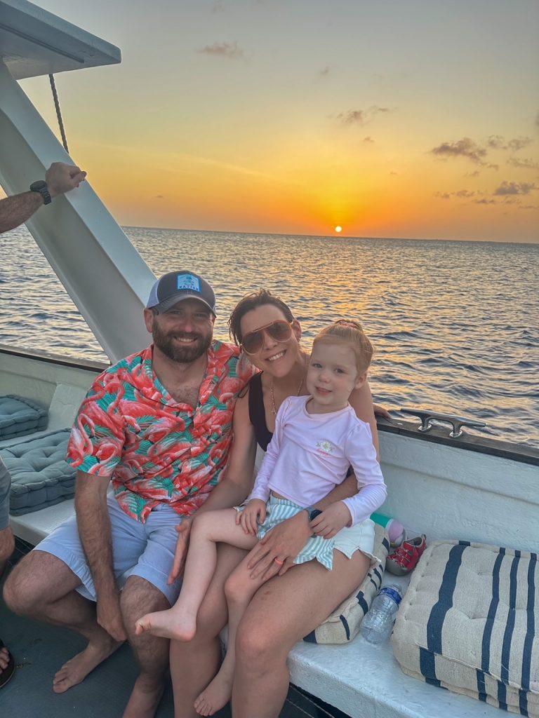 Family on a sunset boat trip in Bonaire
