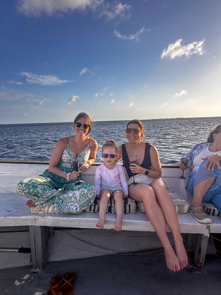 Friends on a sunset boat tour in Bonaire