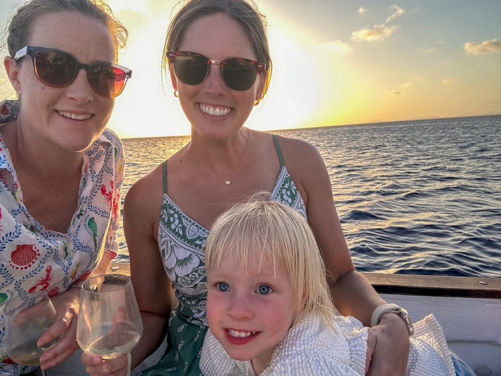 Friends on a sunset boat trip in Bonaire