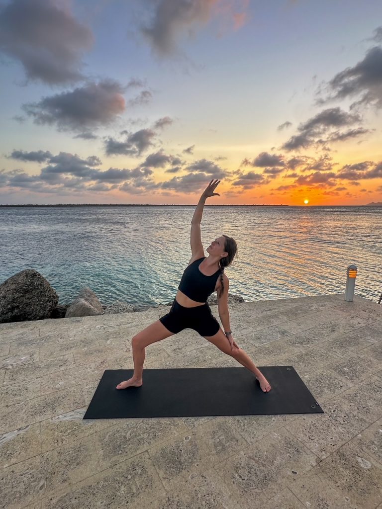 Sara doing Sunset Flow at Harbour Village in Bonaire