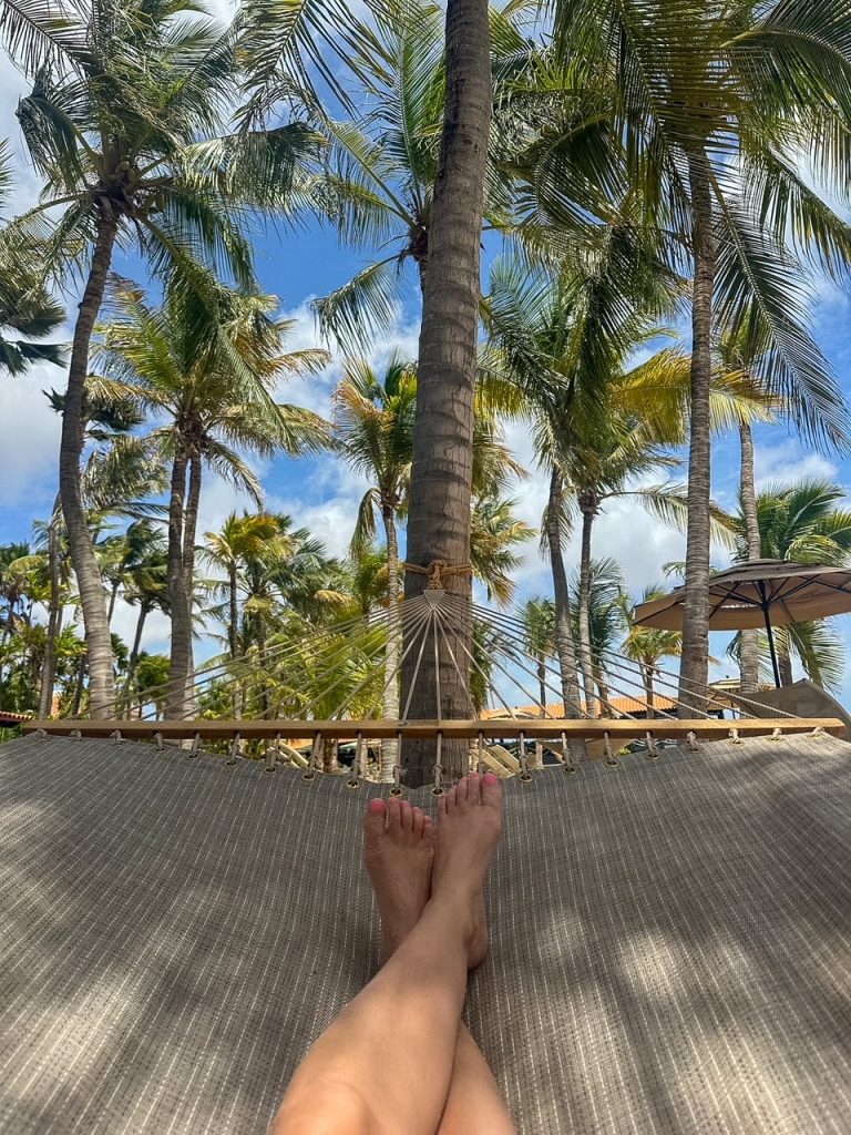 Sara relaxing in a hammock at Harbour Village Beach Club in Bonaire