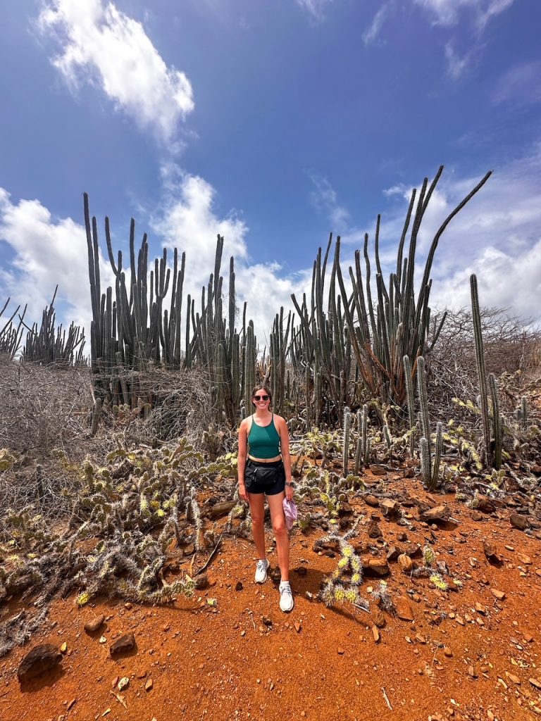 Sara with lots of cacti along the Lagadishi Walking Trail at Washington Slagbaai National Park