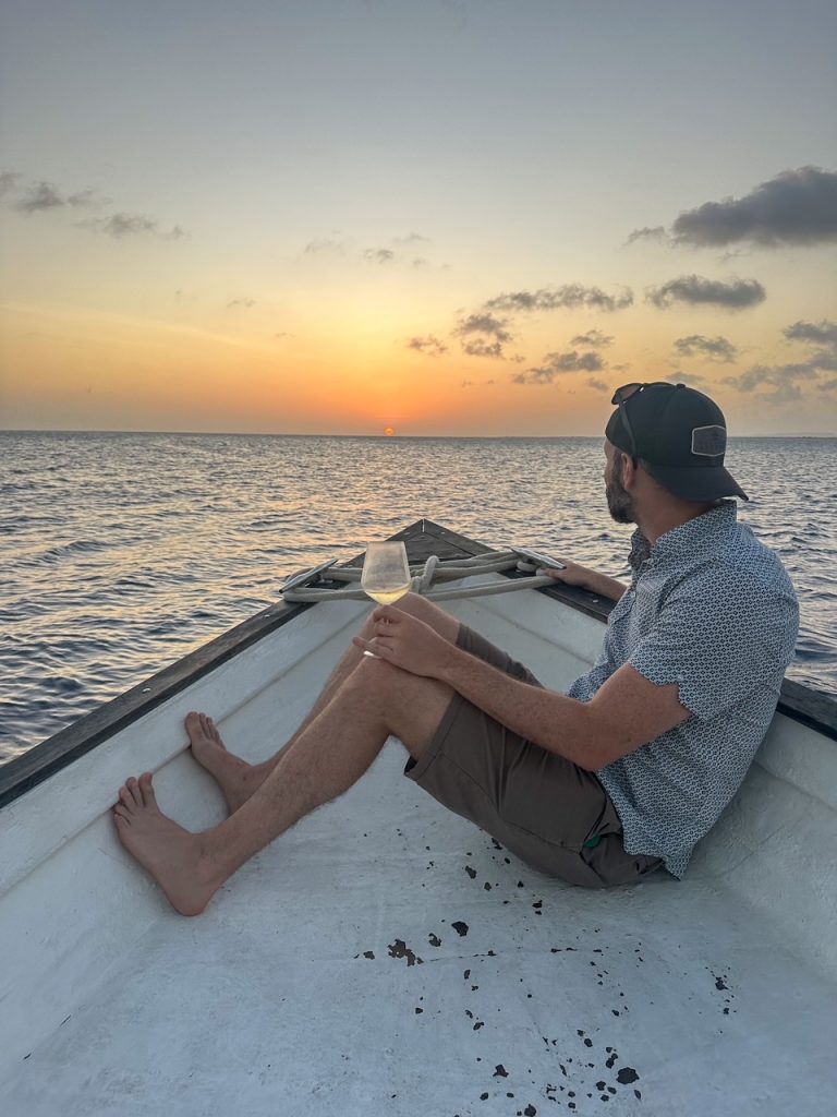 Guest enjoying a drink during the Sushi Sunset Boat Tour in Bonaire