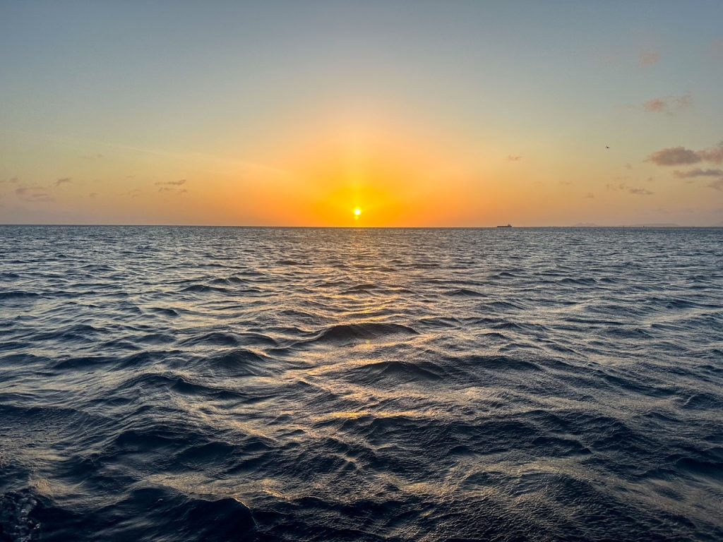 Sunset over the water during our Bonaire sunset sushi cruise