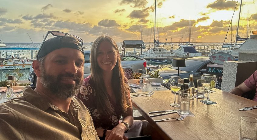 Sara and Tim at It Rains Fishes at sunset for dinner in Bonaire
